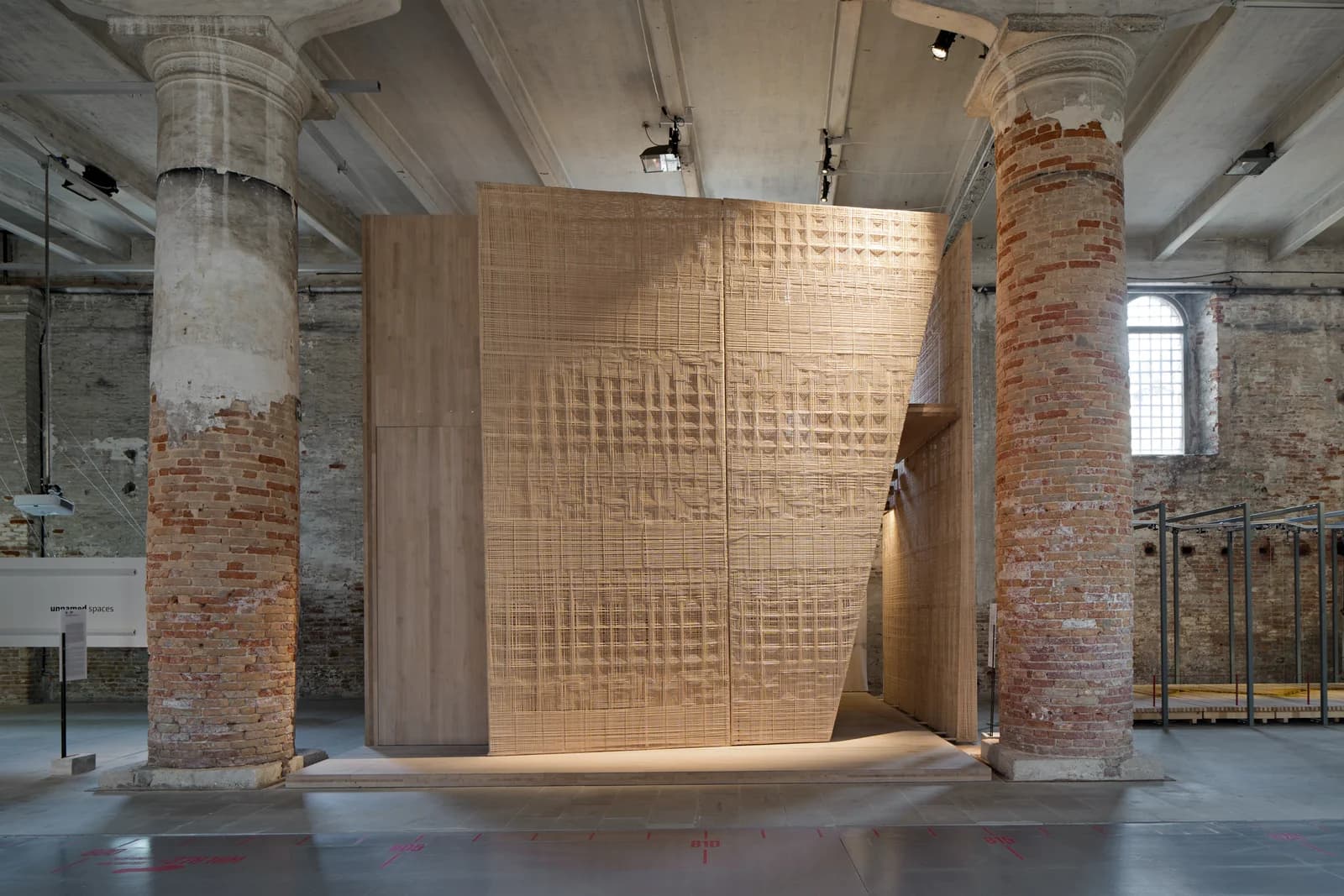 Matter and Place installation at the 16th Venice Architecture Biennale, featuring a rattan weaving facade inspired by diverse Indonesian textile patterns.